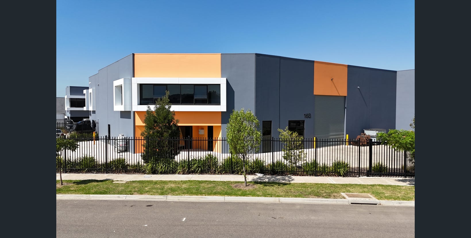 Orange and grey commercial warehouse with office frontage